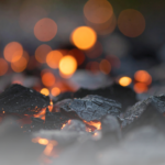 Close up image of charcoal with embers