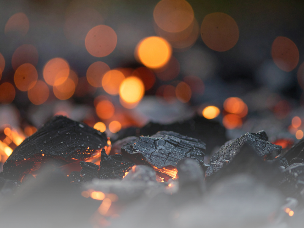 Close up image of charcoal with embers